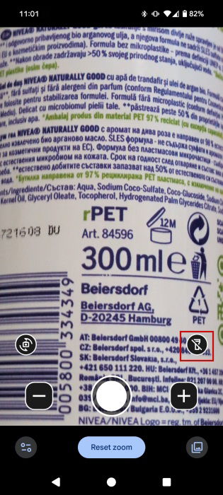 Using Google Magnifier's live camera to view small text on shower gel bottle.